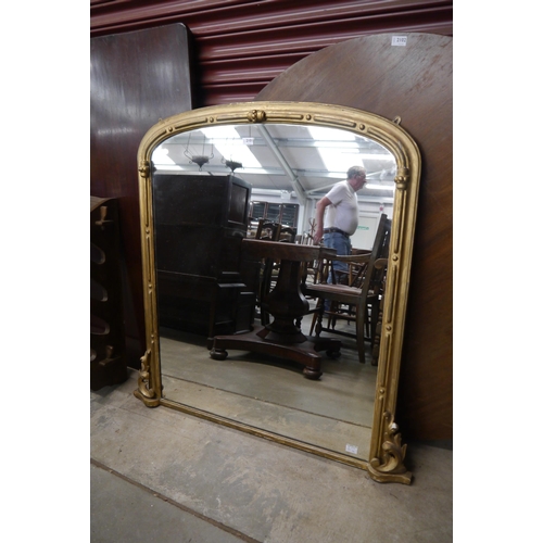 2101 - A Victorian gilt framed overmantel mirror, round-cornered top, scrolled foliate mounts