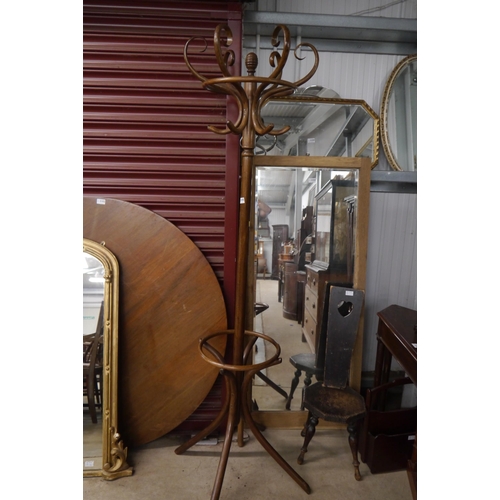 2105 - A coat and hat stand with umbrella ring