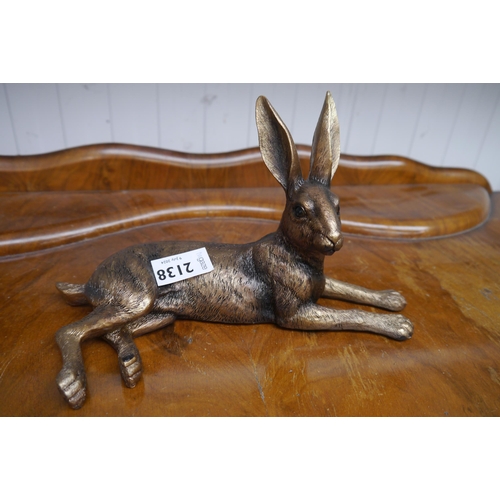 2138 - A resin bronze recumbent shelf sitting hare