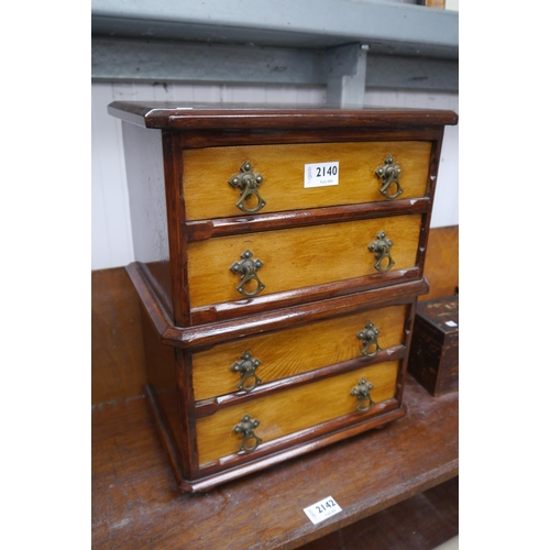 2140 - A small Victorian oak chest of four drawers