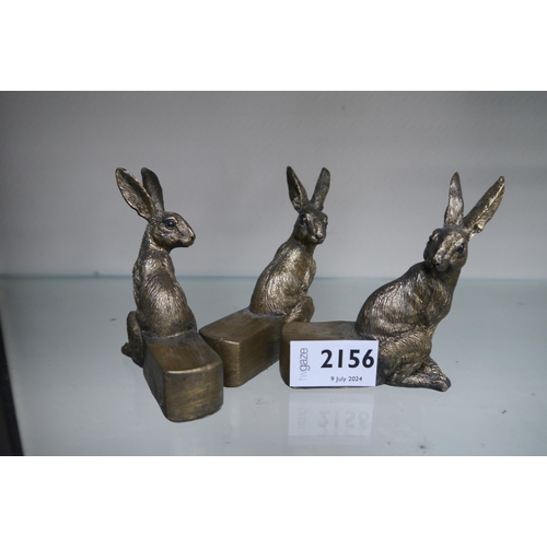 2156 - Three miniature bronzed hares as plant pot feet