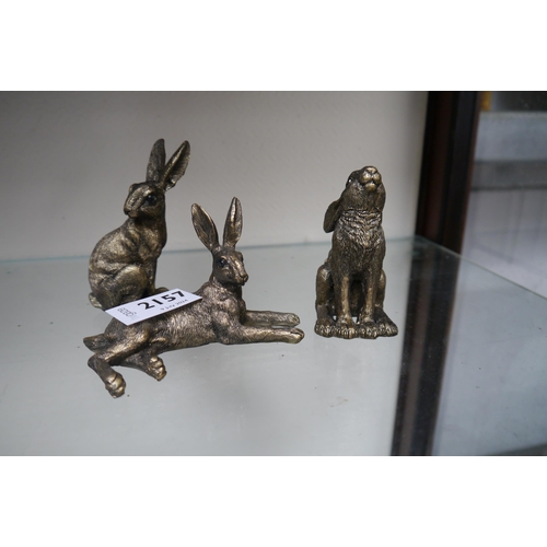 2157 - Three miniature resin bronze hares