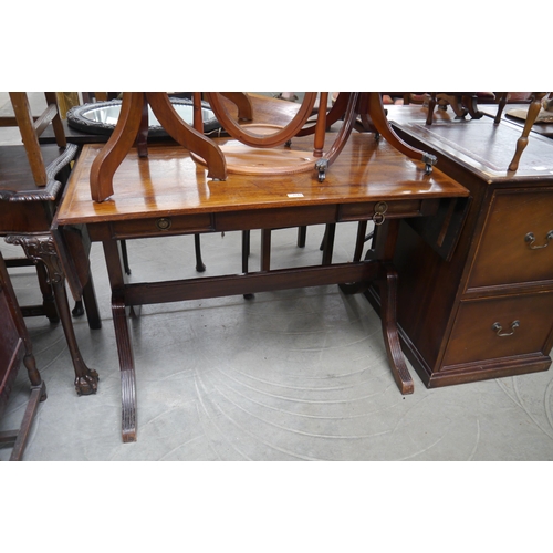 2168 - A drop-leaf hall table with twin frieze drawers on outswept legs joined by stretcher