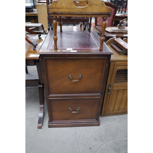 2169 - A reproduction filing cabinet with tooled oxblood leather top, chip to veneer