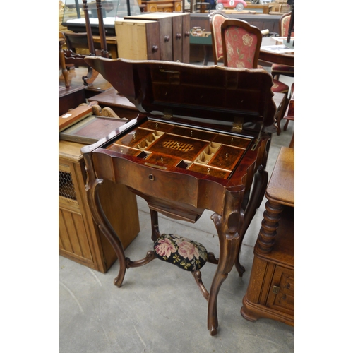 2174 - A Victorian walnut lift up lid work table with fitted drawer