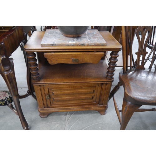 2175 - A French oak linen fold pot cupboard with marble top