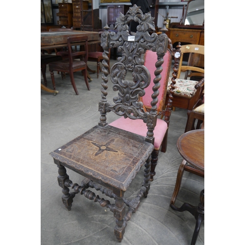 2188 - A carved oak hall chair, turned leg supports, barley-twist backrest supports