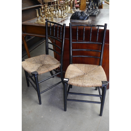 2199 - A pair of Victorian rush seated side chairs ebonised frame