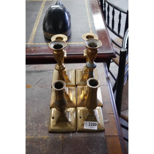 2200 - Three pairs of brass candlesticks