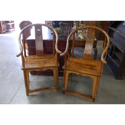 2204 - A pair of stripped Chinese Shenzhen elm bow back oriental monks chairs   (R) £150