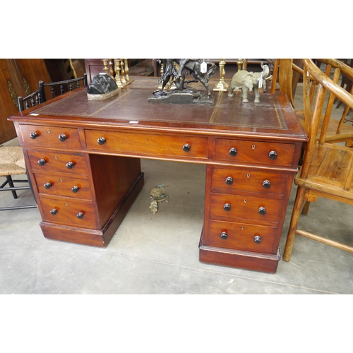 2209 - A Victorian mahogany double pedestal kneehole desk with tooled brown leather inset top, nine drawer ... 