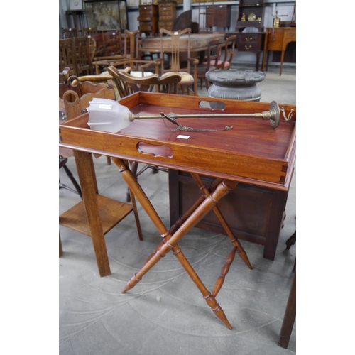 2215 - A mahogany butlers tray on folding stand