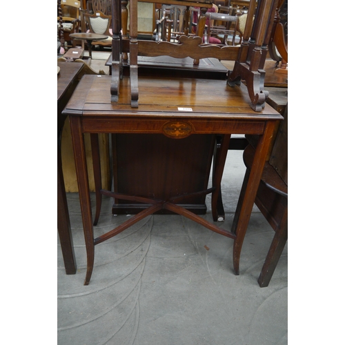 2218 - An Edwardian mahogany inlaid table