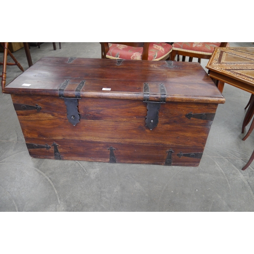 2230 - An eastern hardwood chest with wrought metal fittings