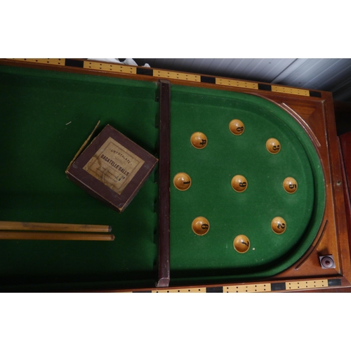 2258 - An E.J. Riley bagatelle board with balls and cues