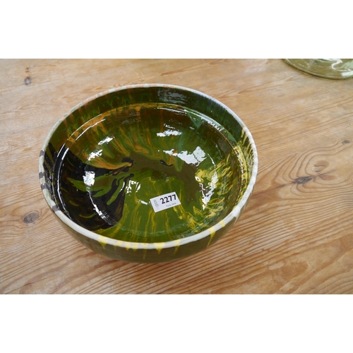 2277 - A green glazed pottery bowl