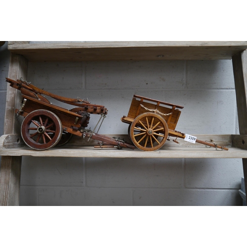 2309 - Two wooden model two wheel tumbrils