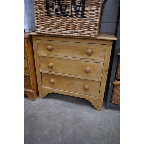 2315 - A Victorian stripped pine chest of three drawers