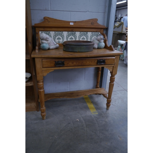 2324 - A Victorian pine wash stand with Nouveau style tiled back