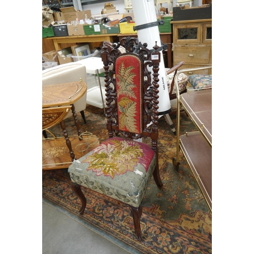 2351 - A Victorian carved walnut chair with barley twist and carved supports on cabriole fore legs, upholst... 