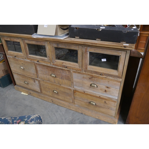 2371 - A pine twelve drawer side board