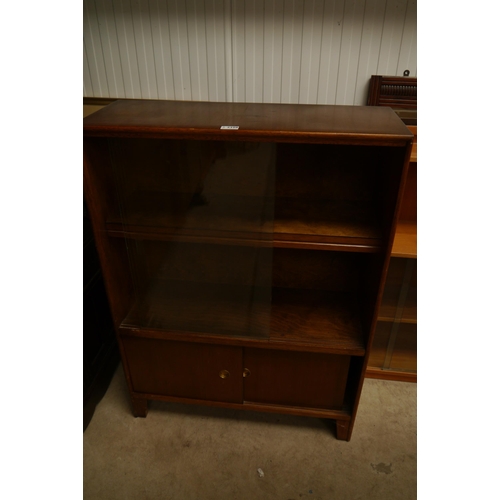 2398 - An 1950's oak bookcase with sliding doors