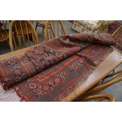 2436 - A red and blue ground rug, a/f 230cm x 145cm