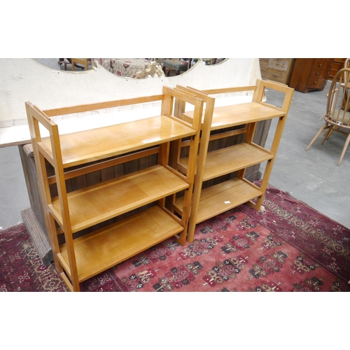 2440 - A pair of beech stacking and folding bookcases