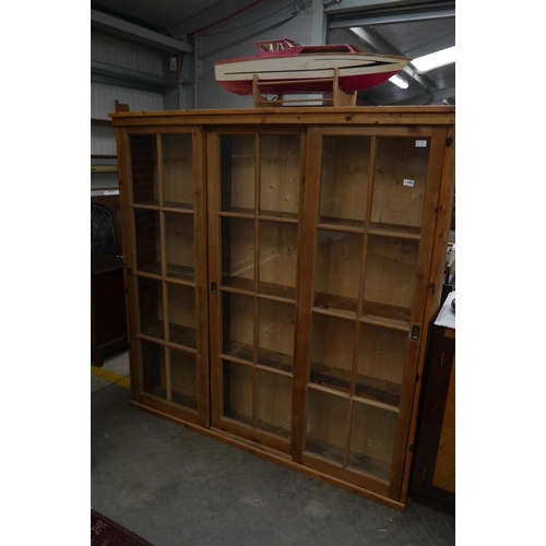 2451 - A pine full height glazed display cabinet / bookcase with three sliding doors 168w x 171t x 29cm dee... 