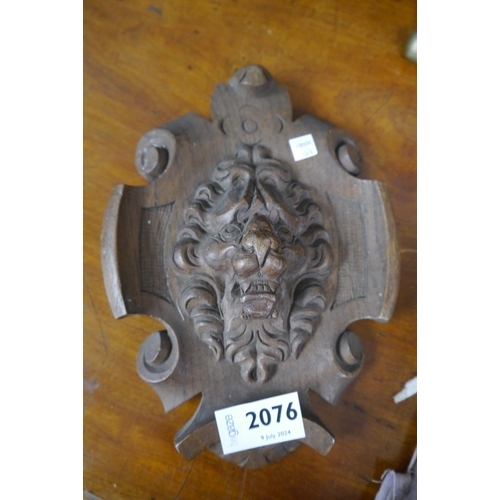 2076 - A pair of Victorian carved oak lions head plaques