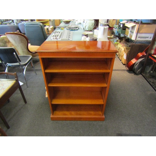 1449 - A yew wood floor standing bookcase with adjustable shelves, 97cm tall x 78cm wide x 31cm deep