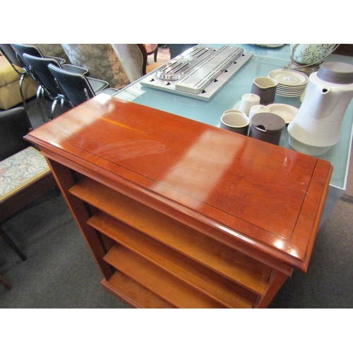 1449 - A yew wood floor standing bookcase with adjustable shelves, 97cm tall x 78cm wide x 31cm deep