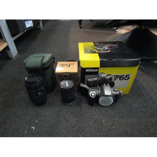 1467 - A Nikon F65 film camera, 28-80mm lens and a 70-300mm Sigma lens/Nikon mount