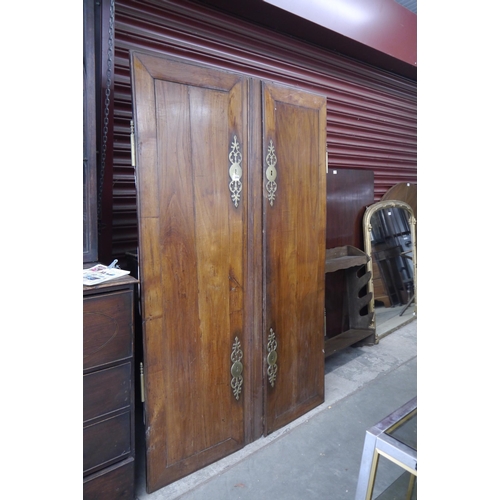 2098 - A pair of 19th Century walnut wardrobe doors