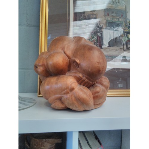 1237 - A carved hardwood figure of the crying buddha Yogi, 25cm high            (E) £15-20