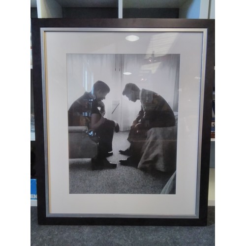 1215 - A black and white photographic image of Jack and Bobby Kennedy, framed and glazed, 64cm x 50cm