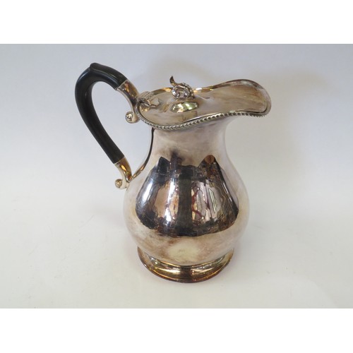 1088 - Mixed silver-plated service ware, including two wood-lined decanter stands, a three sconce table-cen... 