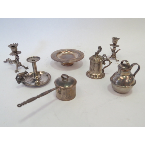 1104 - An Edwardian silver miniature pedestal paten London 1902 and a miniature pepperette as a Jersey milk... 