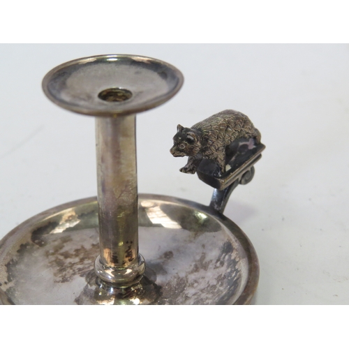 1104 - An Edwardian silver miniature pedestal paten London 1902 and a miniature pepperette as a Jersey milk... 