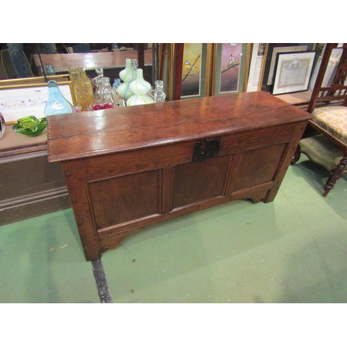 4004 - A Circa 1760 planked oak coffer with chip carved decorated lid having iron clasp over a panel front ... 