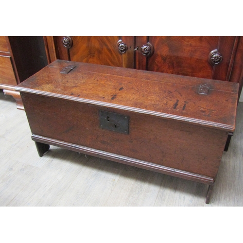 4005 - A 17th Century oak planked coffer of small proportions, the iron hinged lid over arch end supports, ... 