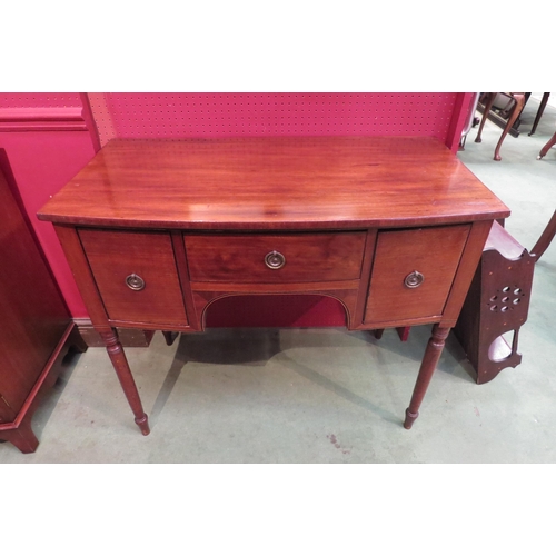 4008 - A 19th Century mahogany bow front sideboard of small proportions, the three drawers over turned and ... 