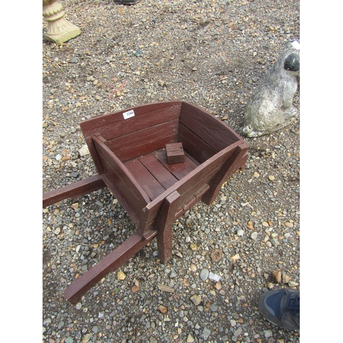 3366 - A wooden wheelbarrow planter