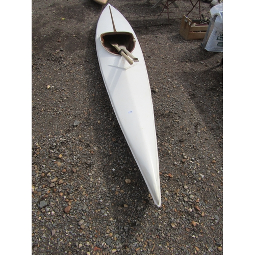 3375 - A fibreglass canoe with oars