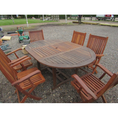 3461 - A hardwood extending garden table with six chairs