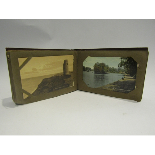 4306 - A postcard album containing written cards of the Somme, WWI scenes, village scenes, some coloured so... 