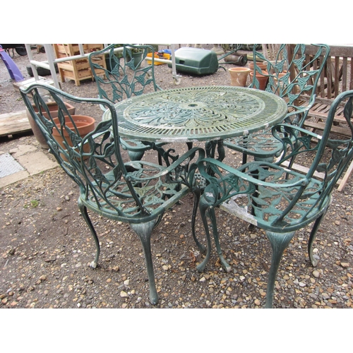 3489 - A cast alloy garden table and four chairs