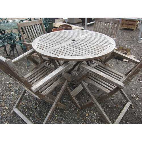 3490 - A hardwood table and four chairs