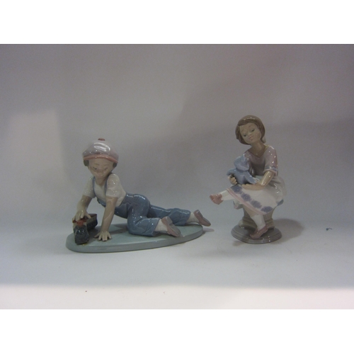 4277 - Two Lladro figures - Boy with train and Girl with Teddy Bear