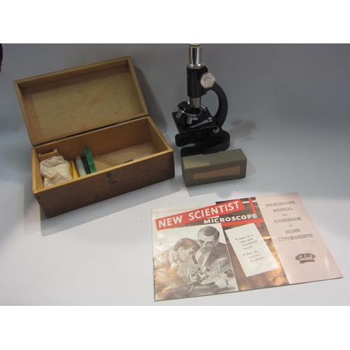 4311 - A New Scientist student microscope in pine box with instruction leaflet